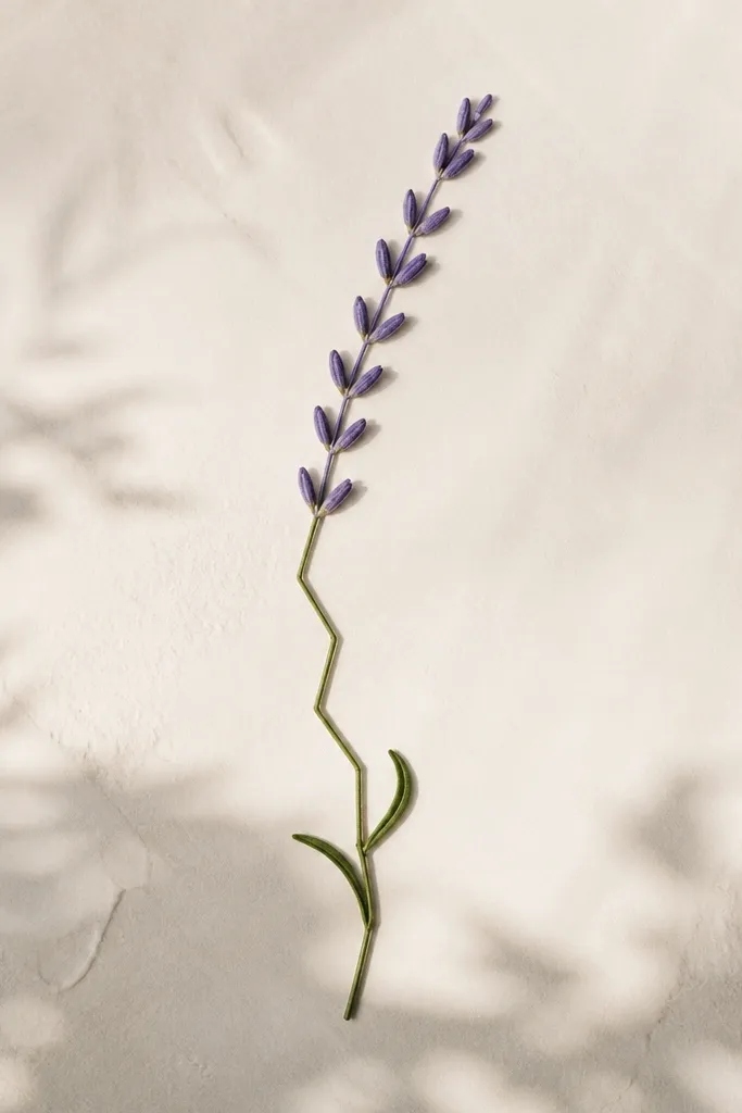 A lavender sprig where the stem is a gentle zigzag line. The lavender head is a line of small V-shaped spikes, and two leaves sit lower on the stem as short curved commas.