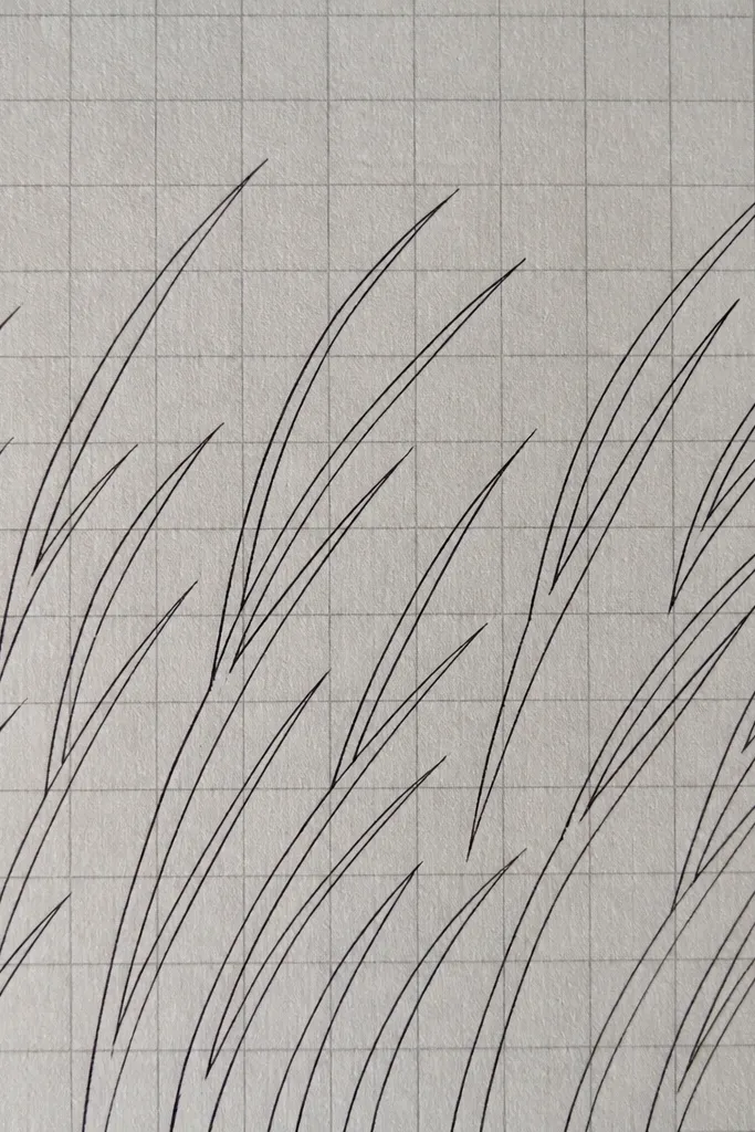 A light grey paper with faint grid lines, overlaid with black outline grass blades that align to the grid spacing and lean in one direction.